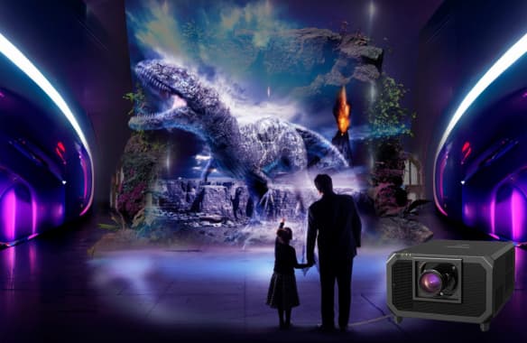Aplicación de proyección 3D con el Panasonic PT-RQ45K en una experiencia temática, creando un entorno realista con dinosaurios para espacios expositivos o museos.