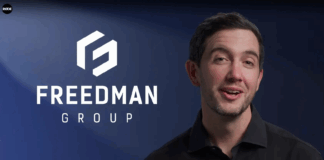 Representante de RØDE junto al logotipo de Freedman Group, matriz de marcas de audio profesional asociada con Audinate.