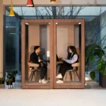 15 VicBooth Office Plus Duo 1x2 Dark Walnut with two persons inside 16x9 1